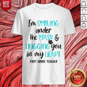 Top I’m Smiling Under The Mask And Liugging You In My Heart First Grade Teacher Shirt