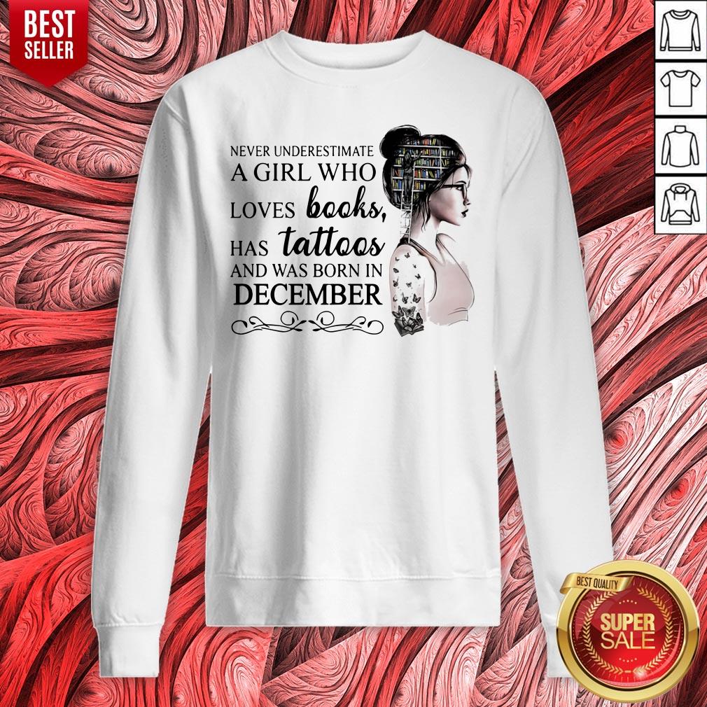 never-underestimate-a-girl-who-loves-books-has-tattoos-and-was-born-in-december-sweatshirt.jpg
