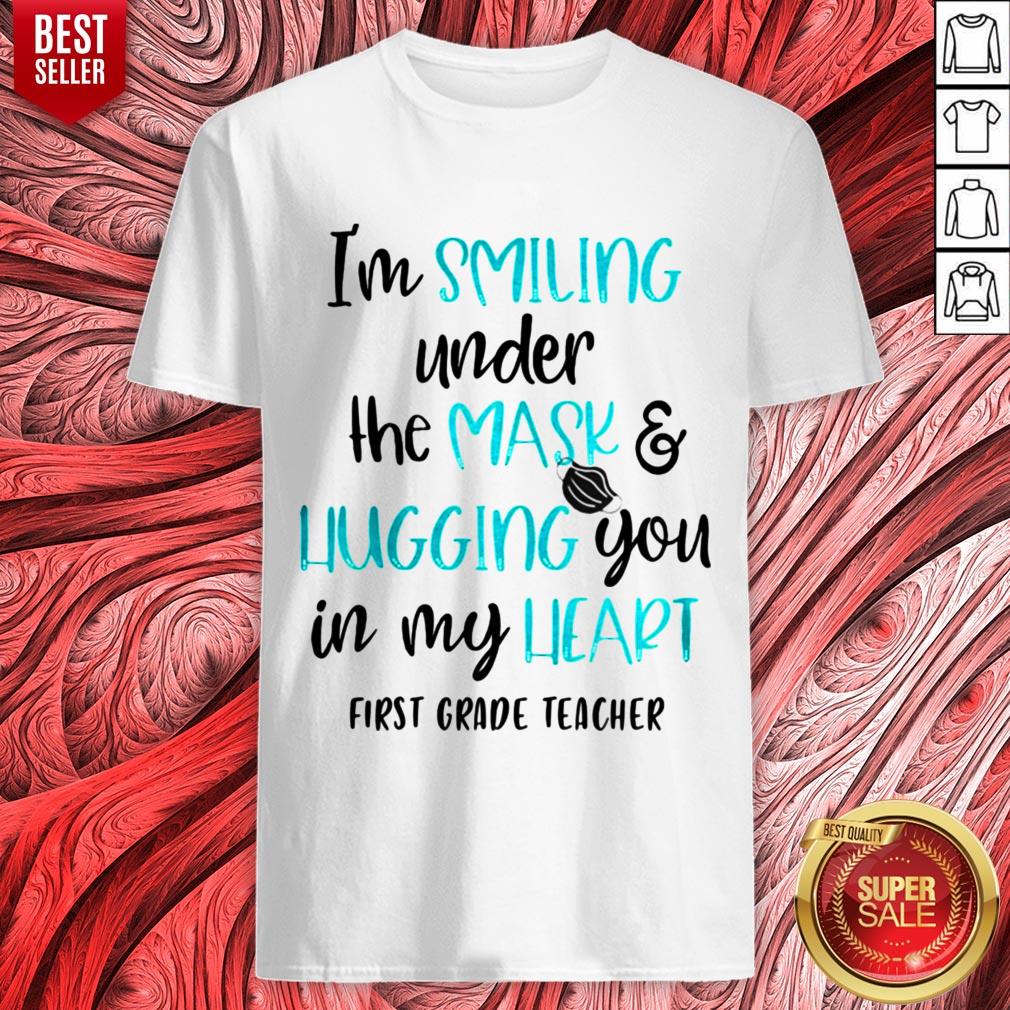 top-im-smiling-under-the-mask-and-liugging-you-in-my-heart-first-grade-teacher-shirt.jpg
