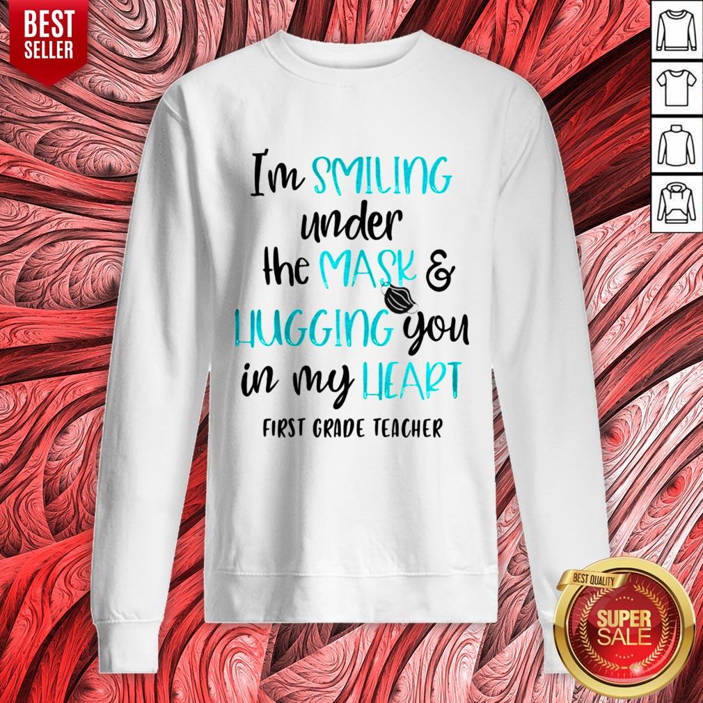 top-im-smiling-under-the-mask-and-liugging-you-in-my-heart-first-grade-teacher-sweatshirt.jpg