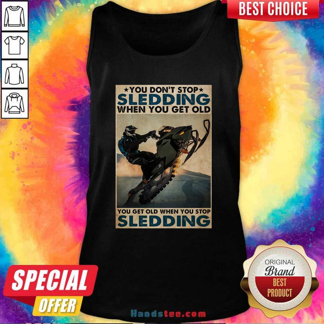 you-dont-stop-sledding-when-you-get-older-you-get-old-when-you-stop-sledding-poster-tank-top.jpg