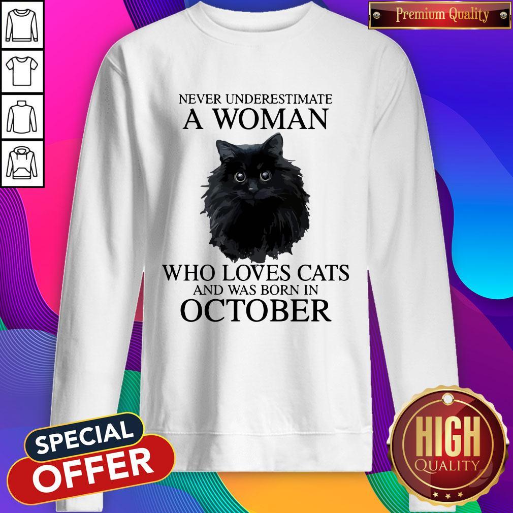 attractive-never-underestimate-a-woman-who-loves-cats-and-was-born-in-october-sweatshirt.jpg