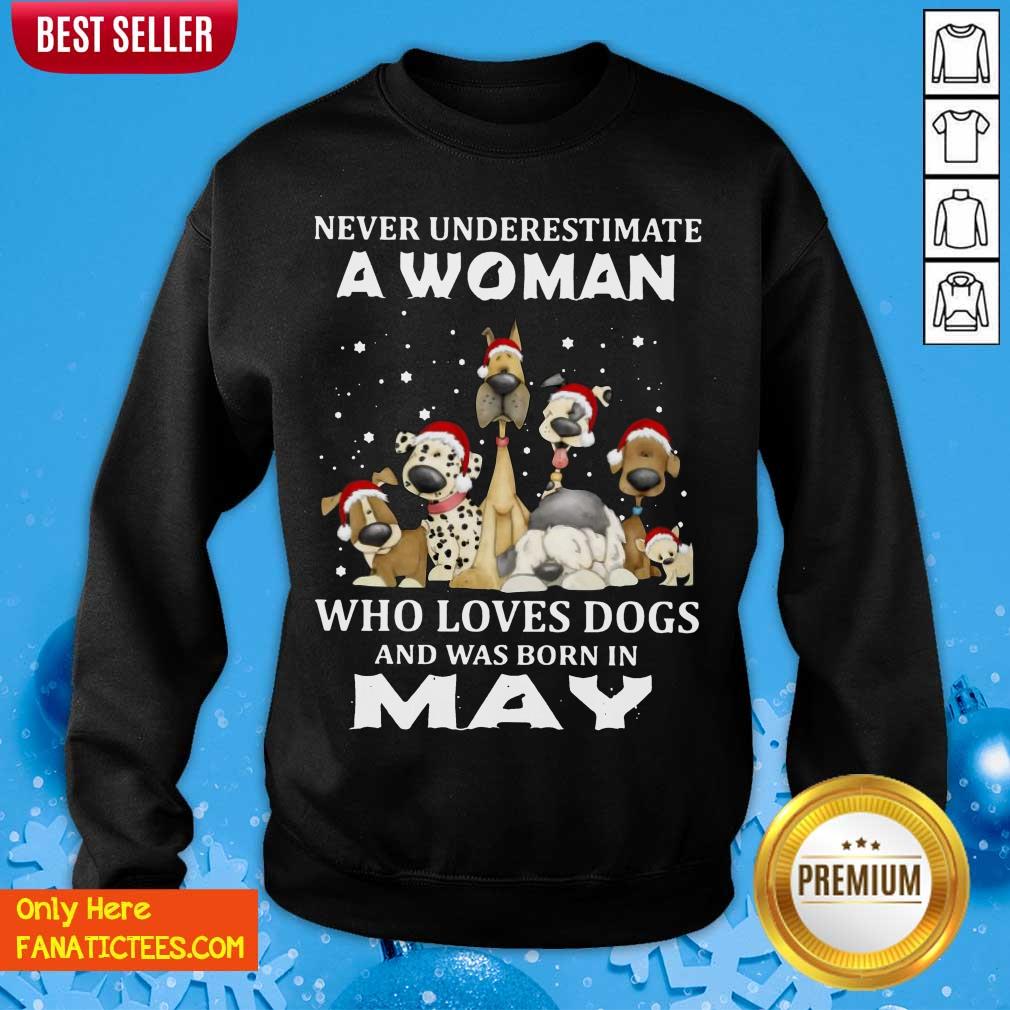 pretty-never-underestimate-a-woman-who-loves-dogs-and-was-born-in-may-christmas-sweatshirt.jpg