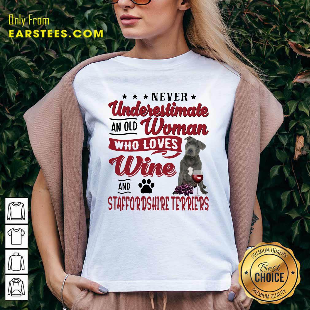 funny-never-underestimate-an-old-woman-who-loves-wine-and-staffordshire-terriers-v-neck.jpg