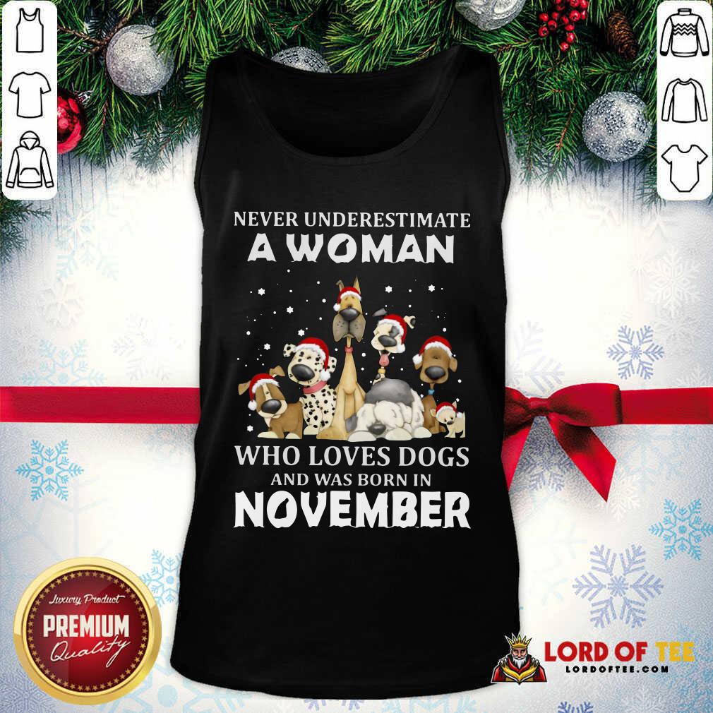 happy-never-underestimate-a-woman-who-loves-dogs-and-was-born-in-november-christmas-tank-top.jpg