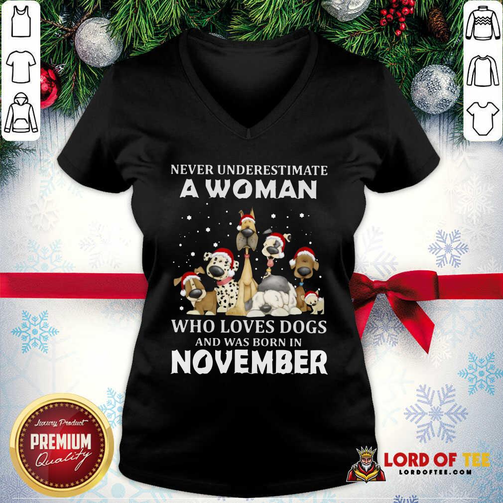 happy-never-underestimate-a-woman-who-loves-dogs-and-was-born-in-november-christmas-v-neck.jpg