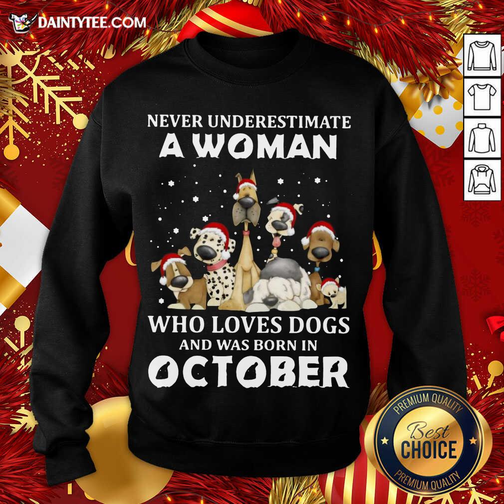 hot-never-underestimate-a-woman-who-loves-dogs-and-was-born-in-october-christmas-sweatshirt.jpg