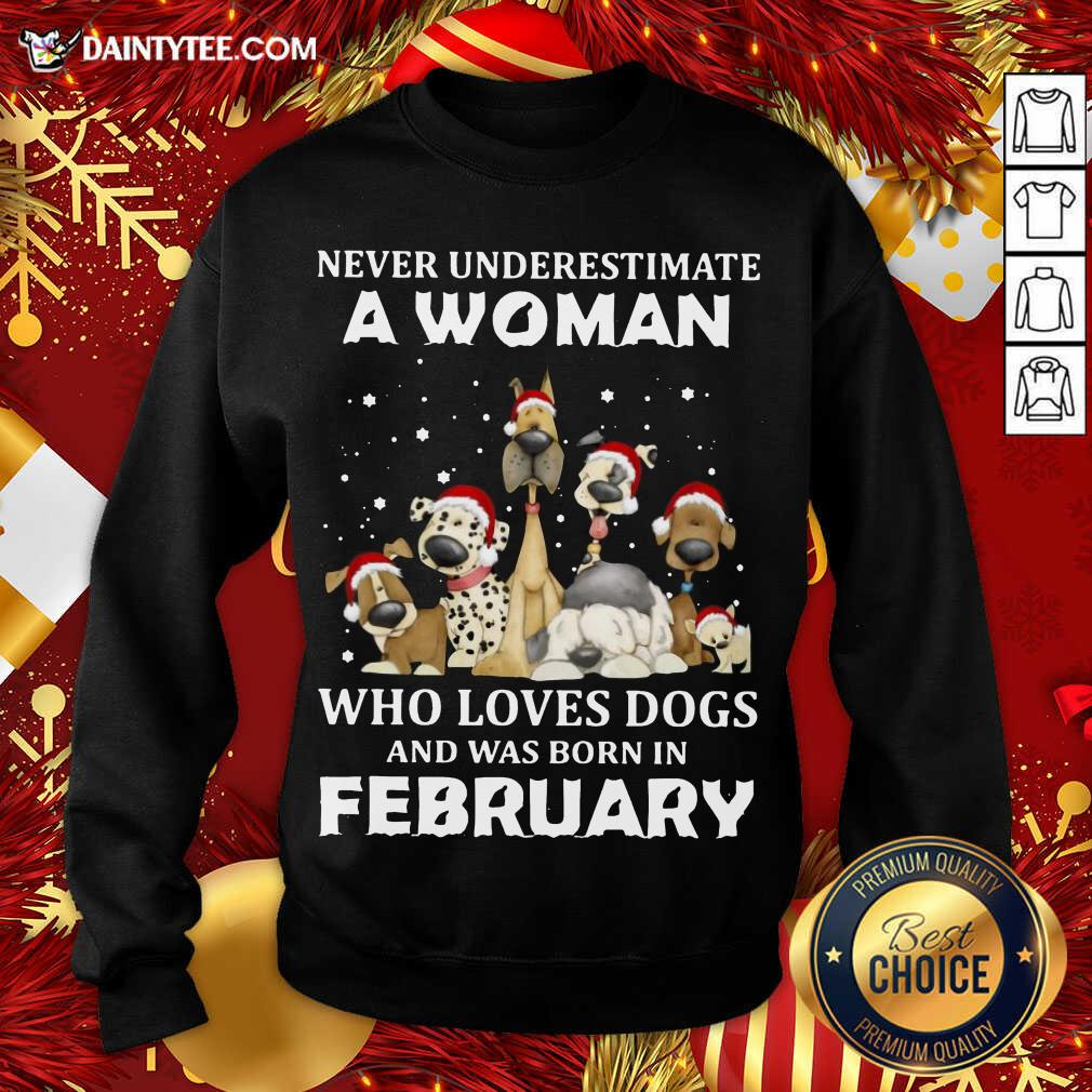 nice-never-underestimate-a-woman-who-loves-dogs-and-was-born-in-february-christmas-sweatshirt.jpg