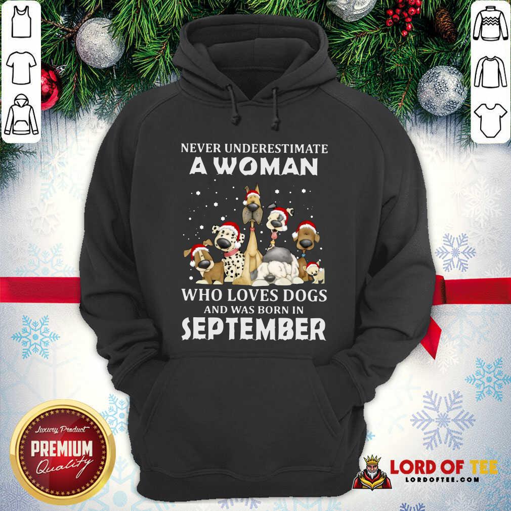 original-never-underestimate-a-woman-who-loves-dogs-and-was-born-in-september-christmahoodie.jpg