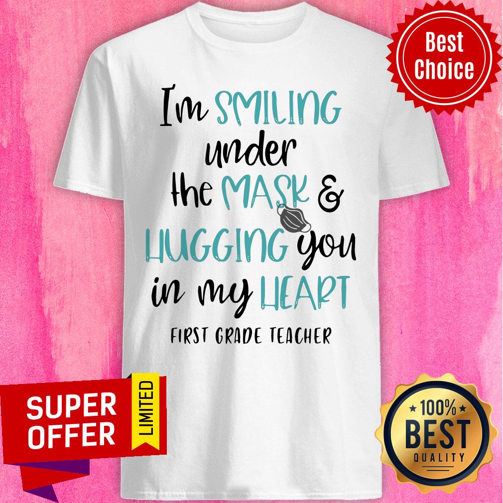 top-im-smiling-under-the-mask-and-hugging-you-in-my-heart-first-grade-teacher-shirt.jpg