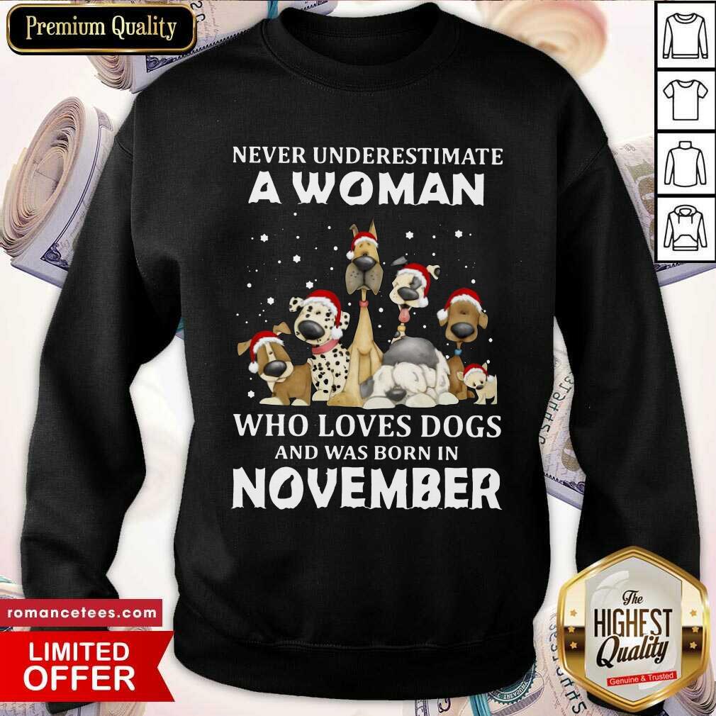 nice-never-underestimate-a-woman-who-loves-dogs-and-was-born-in-august-christmas-sweatshirt.jpg
