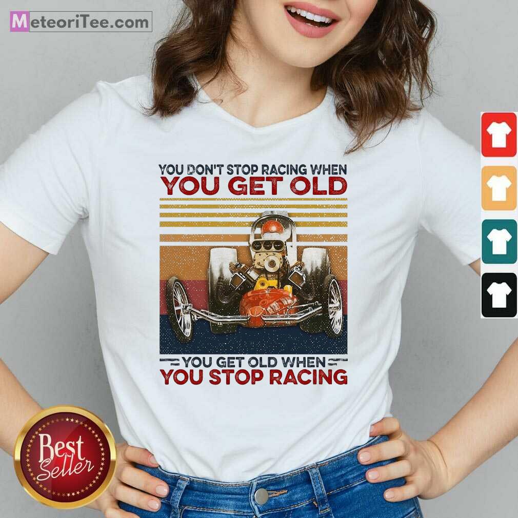 top-you-dont-stop-racing-when-you-get-old-you-get-old-when-you-stop-racing-v-neck.jpg