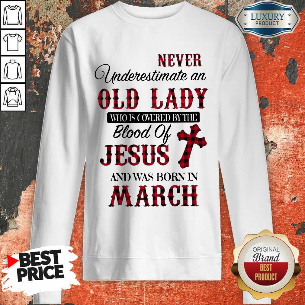 never-underestimate-an-old-lady-who-is-covered-by-the-blood-of-jesus-and-was-born-in-march-sweatshirt.jpg