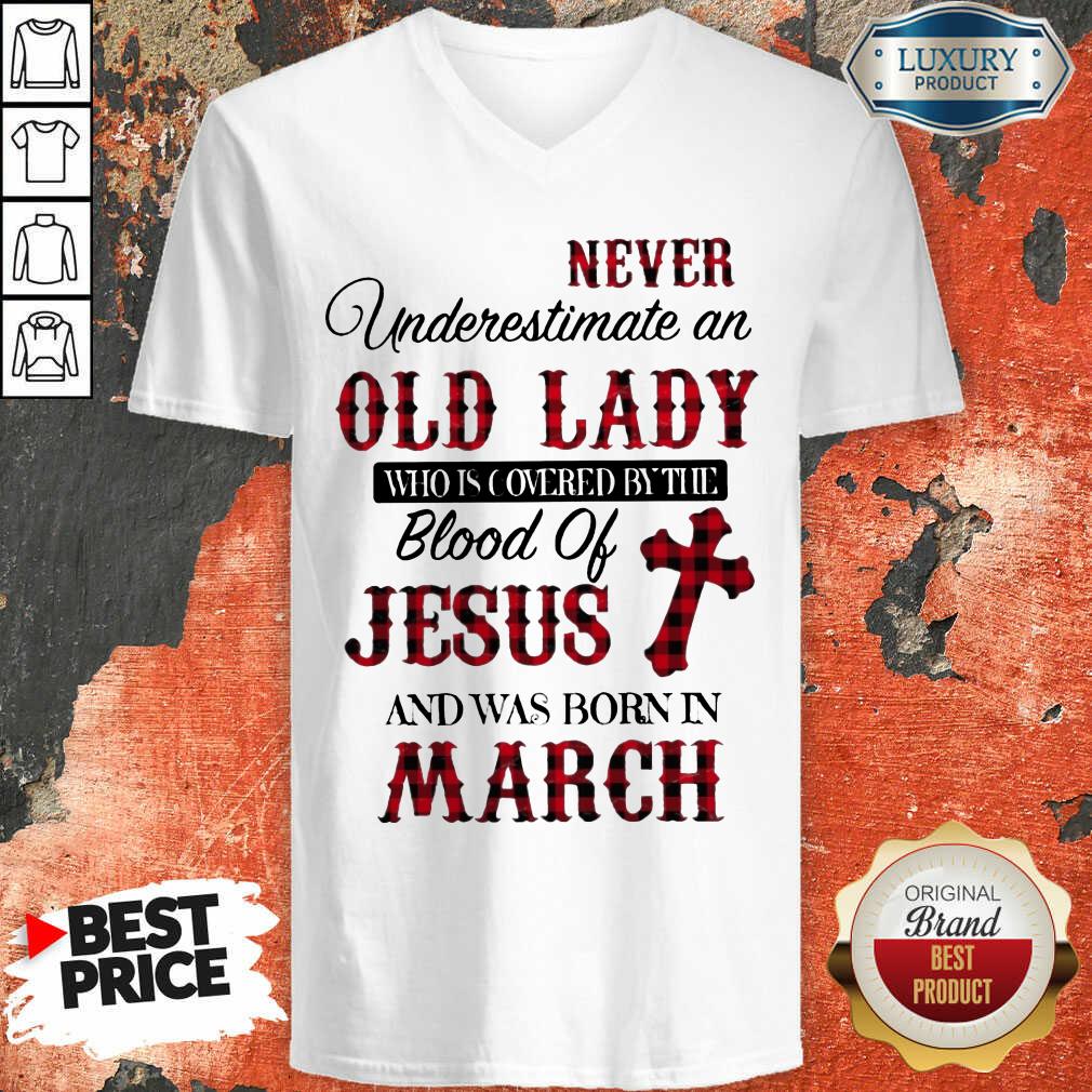 never-underestimate-an-old-lady-who-is-covered-by-the-blood-of-jesus-and-was-born-in-march-v-neck.jpg