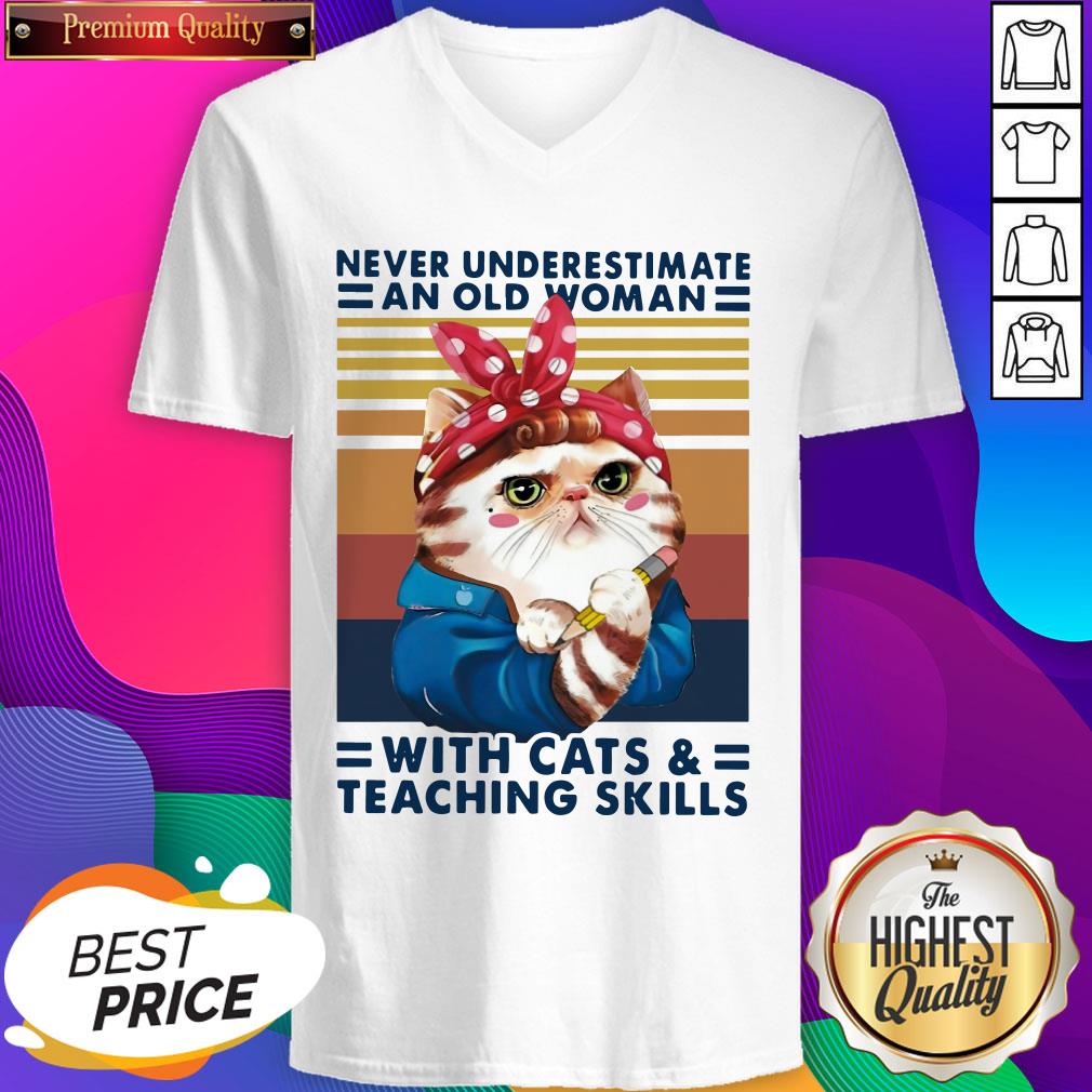 never-underestimate-an-old-woman-with-cats-and-teaching-skills-vintage-retro-v-neck.jpg