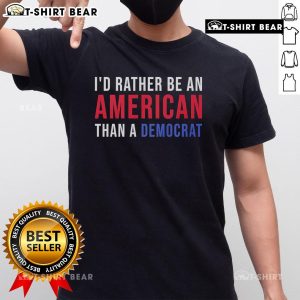 Alt Text: Top 'I'd Rather Be An American Than A Democrat' T-Shirt featuring bold text design in patriotic colors.